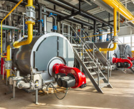 The,Interior,Of,An,Industrial,Boiler,Room,With,Three,Large